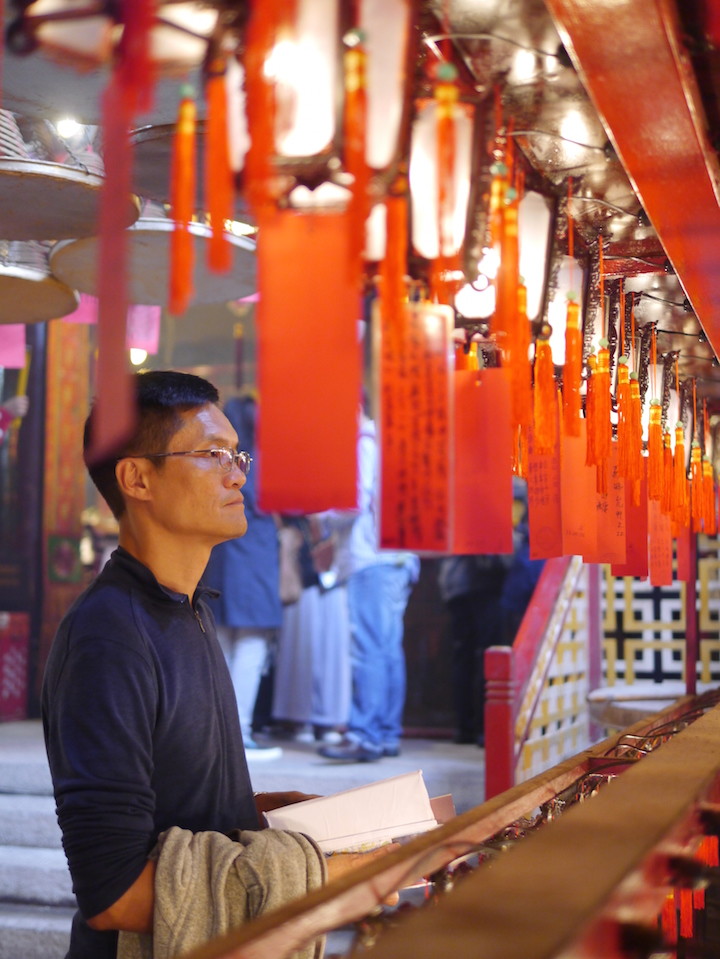 Air was heavy with burning incense and glowing with written prayers on red-I loved Man Mo Temple